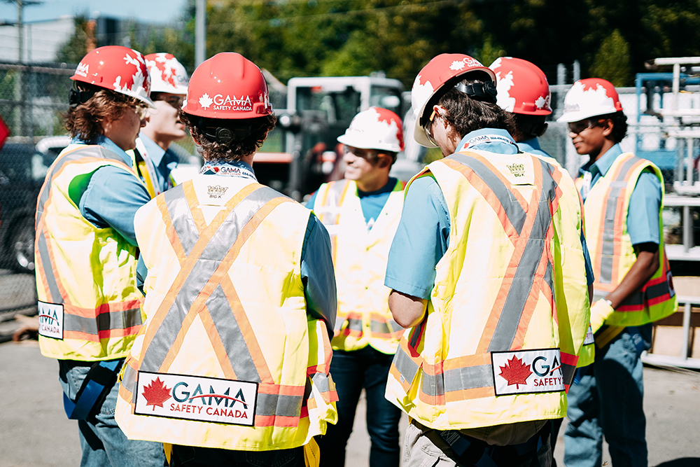 Gama Safety mission – workers in hard hats and safety vests