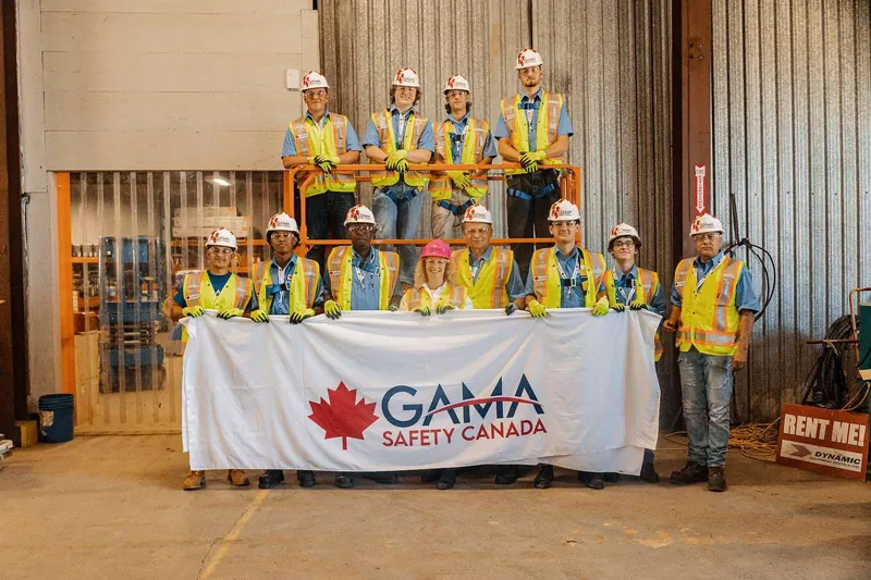 Gama Safety Canada team holding the GAMA SAFETY CANADA banner after a practical training day